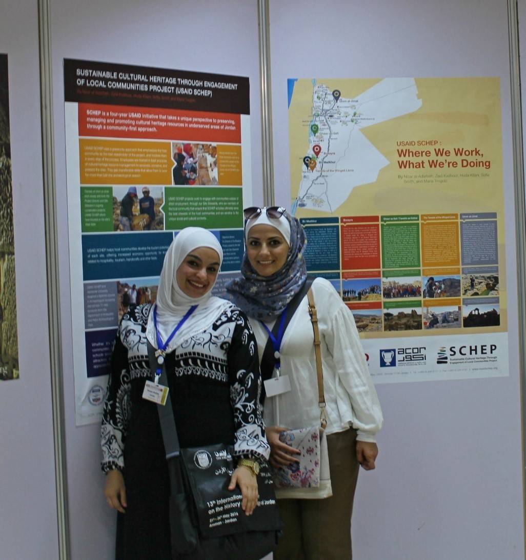 USAID SCHEP interns Haneen Khalifa (left) and Rawan Apsch at the ICHAJ poster session, standing in front of the posters that presented USAID SCHEP’s methodology and on-site work. Photo by Sofia Smith.