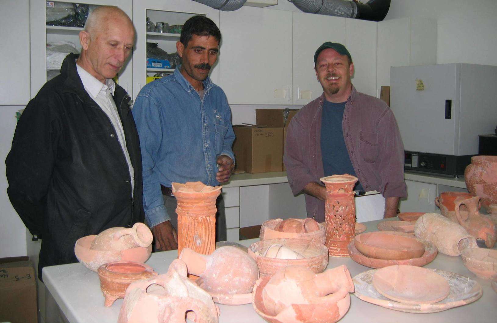 Jean-Baptiste Humbert (EBAF) with Naif Zaban and former ACOR associate director Christopher Tuttle in the ACOR lab examining Amman Citadel ceramic material conserved by Naif. Photo by Barbara A. Porter.