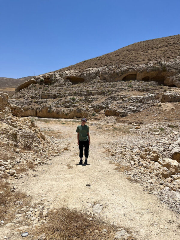 Miya Pletsas surveying in the wadi, Khirbat al-Mukhayyat. (Photo by Christina Quaid.)